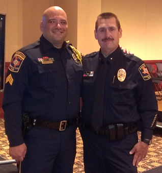 Sgt. Barrera and Inspector Charlie Patnode, both of whom grew up together at UTSA PD, share a moment together at the May 2013 UTSP Academy graduation