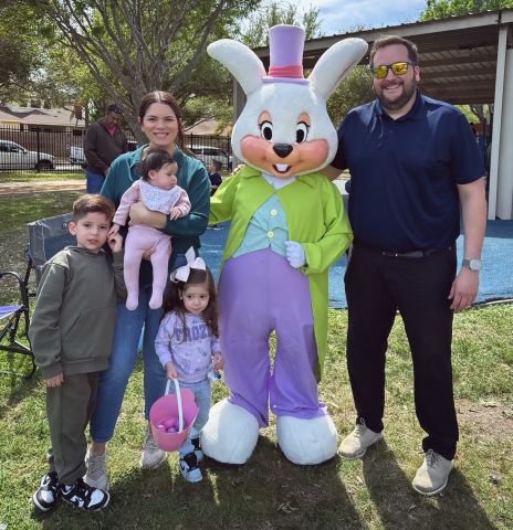 Roxana Rivera, Program Manager at the UT Center at Laredo, poses with her husband and two children — and the Easter Bunny.